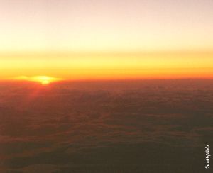 Sunset above clouds
